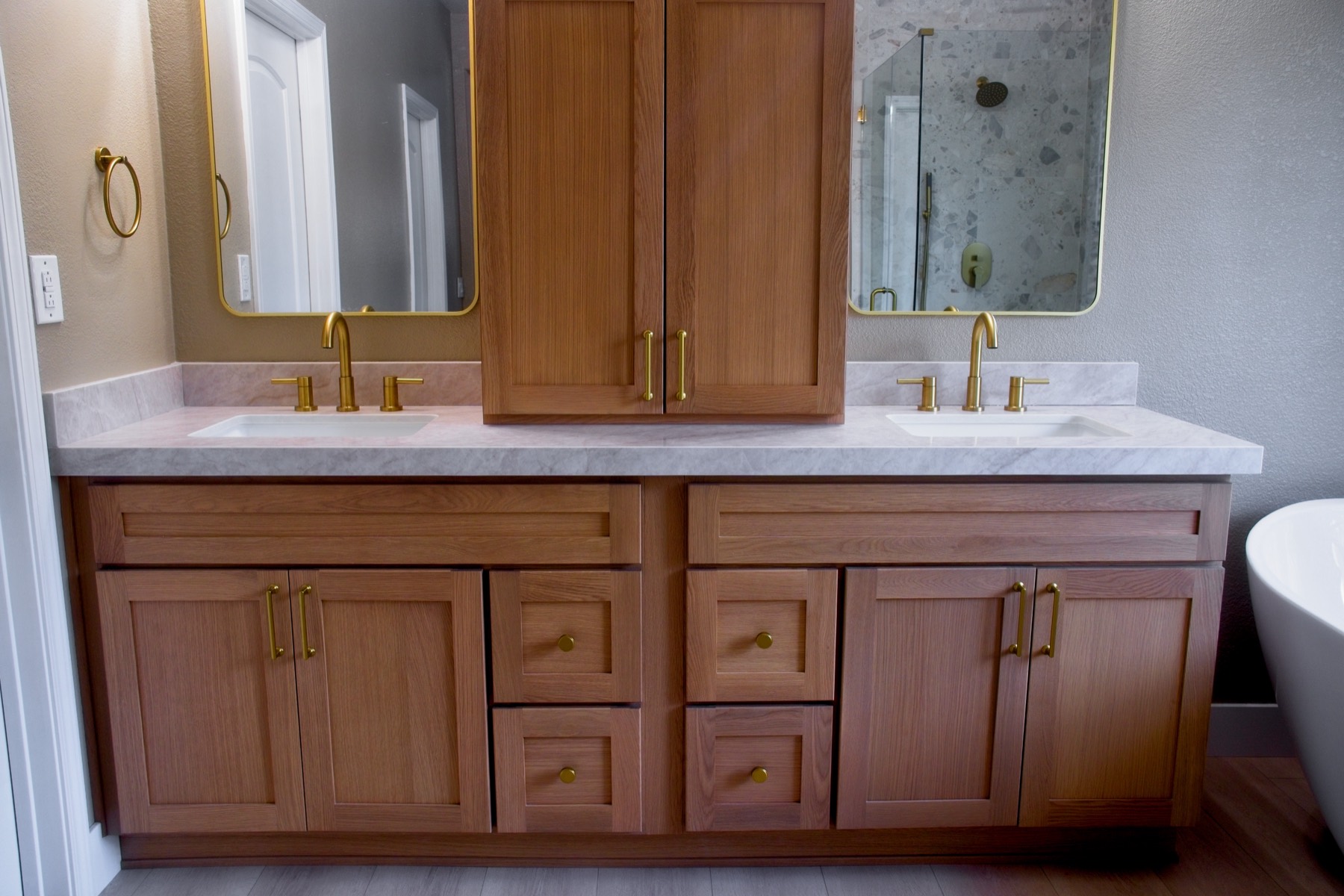 Finished bathroom — double vanity with brass fixtures